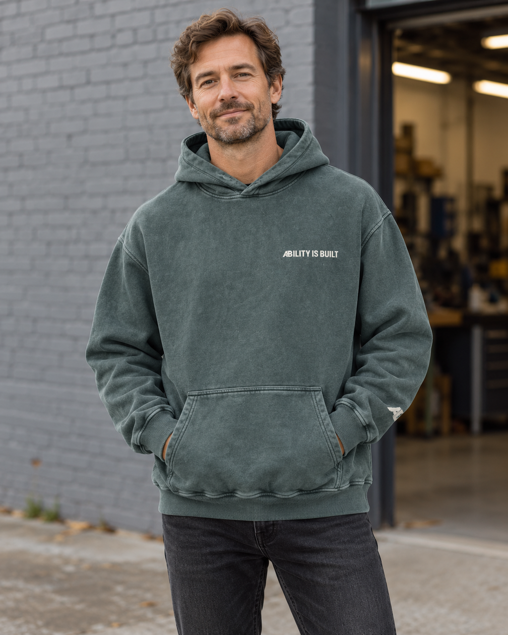 AI-generated lifestyle mockup of the AIB Dark Green hoodie worn by an adult model