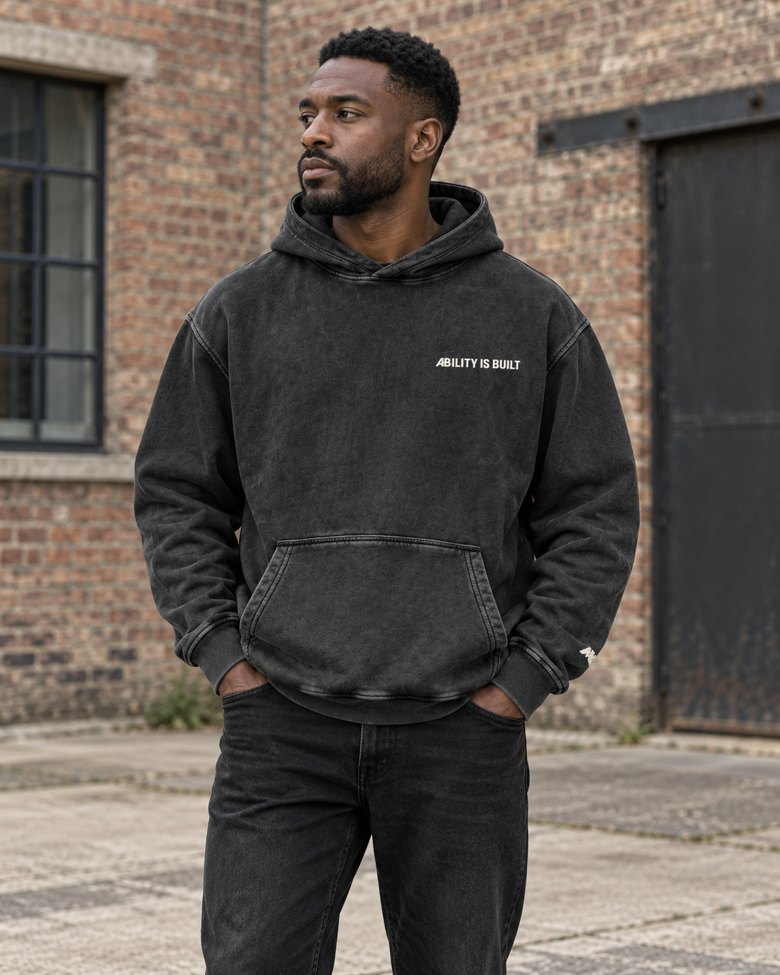 AI-generated lifestyle mockup of the AIB Black Beauty hoodie worn by an adult model